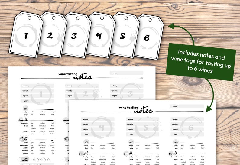 May include: Six white wine tags numbered 1-6 with wine stain designs, and wine tasting notes sheets. A green sign reads "Includes notes and wine tags for tasting up to 6 wines". The image is set on a wooden surface.