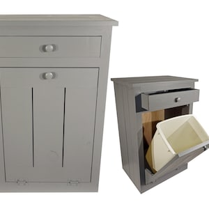 May include: A gray wooden trash can with a pull-out drawer and a hinged door. The door is open, revealing a white plastic trash bin.