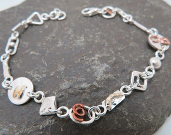 Link bracelet in sterling silver, with yellow gold and copper