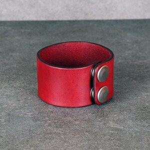 Handmade leather bracelet with dragon engraving.