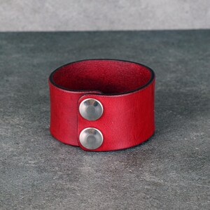 Handmade leather bracelet with dragon engraving.