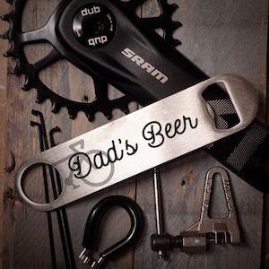 Abridor de botellas de la cuchilla de la barra de acero inoxidable de la bicicleta de cerveza de papá
