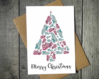 May include: A white card with a Christmas tree made of colorful running shoes. The text "Merry Christmas" is printed below the tree.