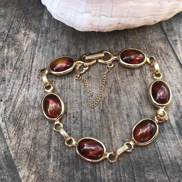 Vintage Sarah Coventry Gold-Tone Bracelet with Oval Chestnut Brown Candy Cane Style Cabochons and Safety Chain  (C-49)