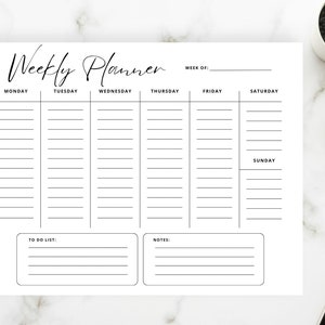 May include: A black and white printable weekly planner with sections for each day of the week, a to-do list, and notes. The planner has the text "Weekly Planner" at the top.