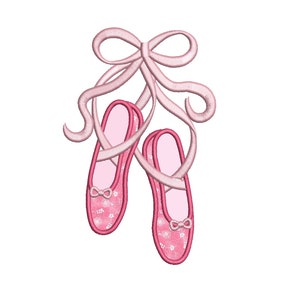 May include: A pair of pink ballet shoes with a pink ribbon tied around them. The shoes have a floral pattern.