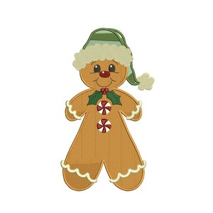 May include: A gingerbread person wearing a green and white striped hat with a white pom-pom. The gingerbread person has red cheeks, a red nose, and a green holly sprig with red berries around its neck. The gingerbread person has two candy cane buttons.