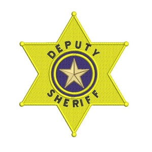 May include: A yellow six-pointed star sheriff's badge with the words "DEPUTY SHERIFF" around a blue circle with a gold star in the center.