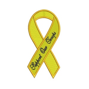 May include: A yellow ribbon with the text "Support Our Troops" in black lettering.