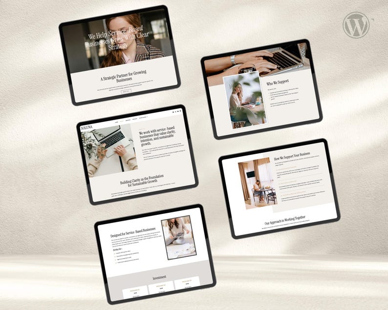 May include: A collection of five tablets displaying website mockups. The screens feature text and images, including the phrases "We Help Service-Based Businesses Grow With Clear Strategy" and "A Strategic Partner for Growing Businesses."