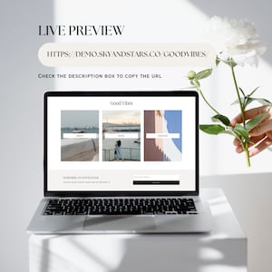 May include: A laptop computer displaying a website with the title "Good Vibes". The website has links to "About", "Blog", and "Contact". There is a subscription box for a newsletter.