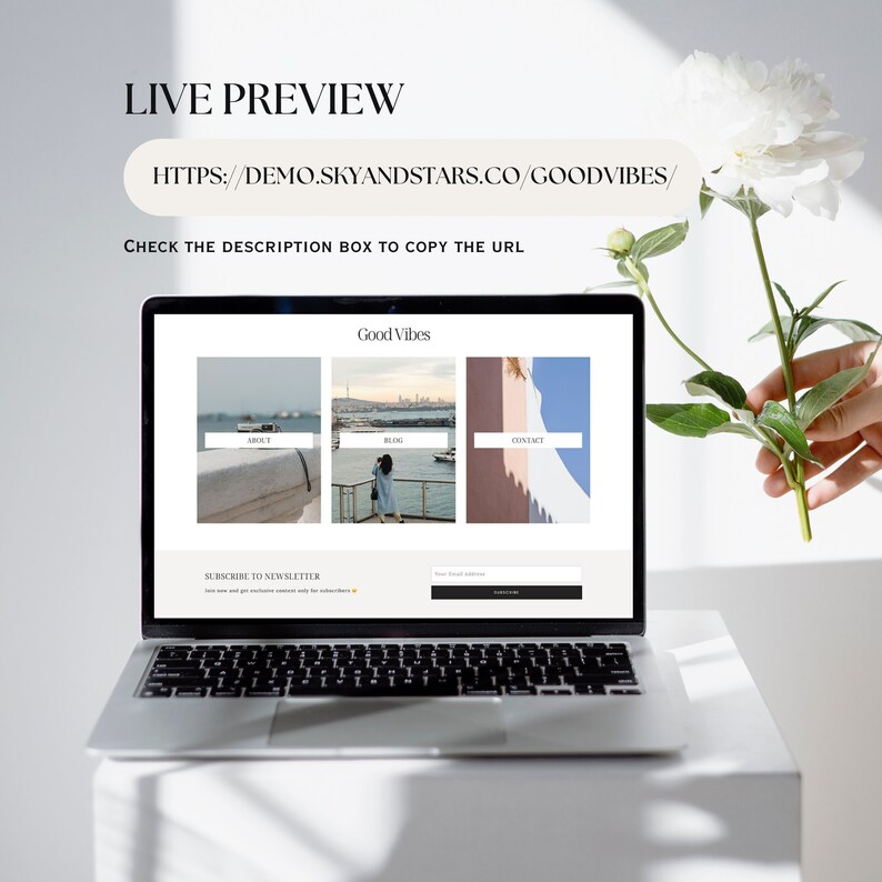 May include: A laptop computer displaying a website with the title "Good Vibes". The website has links to "About", "Blog", and "Contact". There is a subscription box for a newsletter.