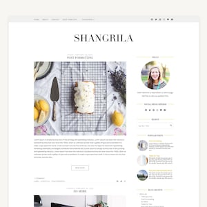 May include: A website layout featuring the word "SHANGRILA" in a serif font. The page includes a blog post with a photo of a cake, lemons, and a cake server. A profile picture of a woman is on the right side.