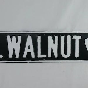 Vintage north walnut jcc arrowhead embossed steel street sign