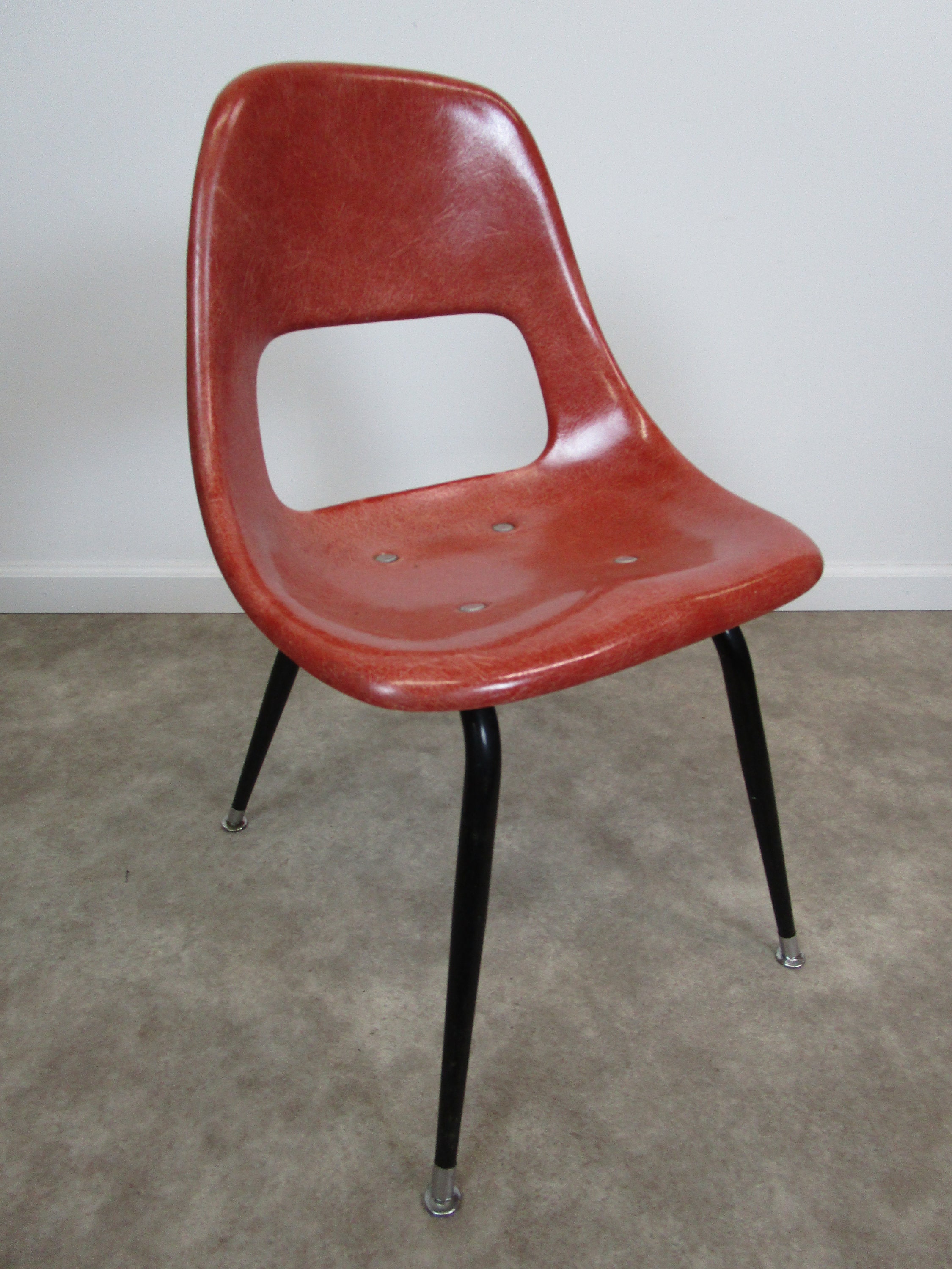 Mid century Sturgis posture fiberglass chair redish orangish