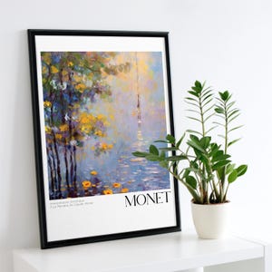 Puede incluir: Una impresión enmarcada de una pintura de Claude Monet. La pintura representa una escena brumosa con árboles y agua. El texto "MONET" está impreso en negro en la parte inferior de la impresión. El texto "Interpretation Artistique A la Maniere de Claude Monet" está impreso en negro en la parte inferior de la impresión.