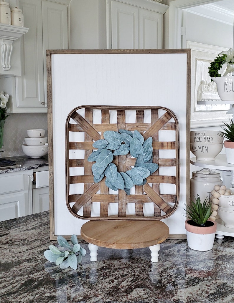 Square Tobacco Basket with Eucalyptus Wreath.