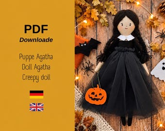 May include: A fabric doll with black yarn hair in braids, wearing a black dress with a white collar. The doll holds a small orange felt pumpkin. Text on the left reads: PDF Downloade, Puppe Agatha, Doll Agatha, Creepy doll, with German and UK flags.