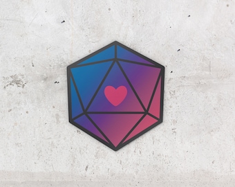 Puede incluir: Un dado degradado en rosa y azul con un contorno negro y un corazón rosa en el centro.