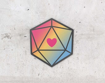 Puede incluir: Un dado de 20 caras de color arcoíris con un corazón rosa en el centro. El dado es un accesorio de juego popular.