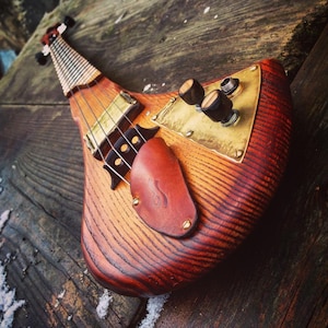 Electric fretted cellotar. 4-string cellotar by DaShtick guitars