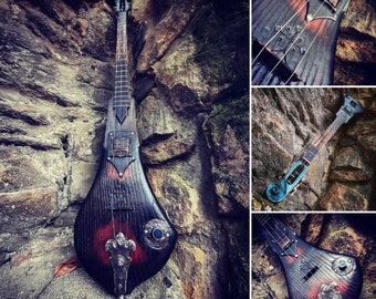 Medieval 3 string guitar. Electric cellotar.