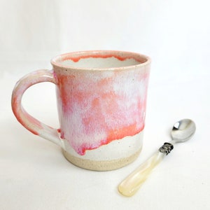 Handmade stoneware coffee mug in oatmeal and salmon pink mottled glazes with drips, 12oz or 350ml coffee cup