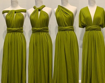 May include: Four mannequins are wearing different styles of a green infinity dress. The dress can be worn in multiple ways, creating different necklines and straps.