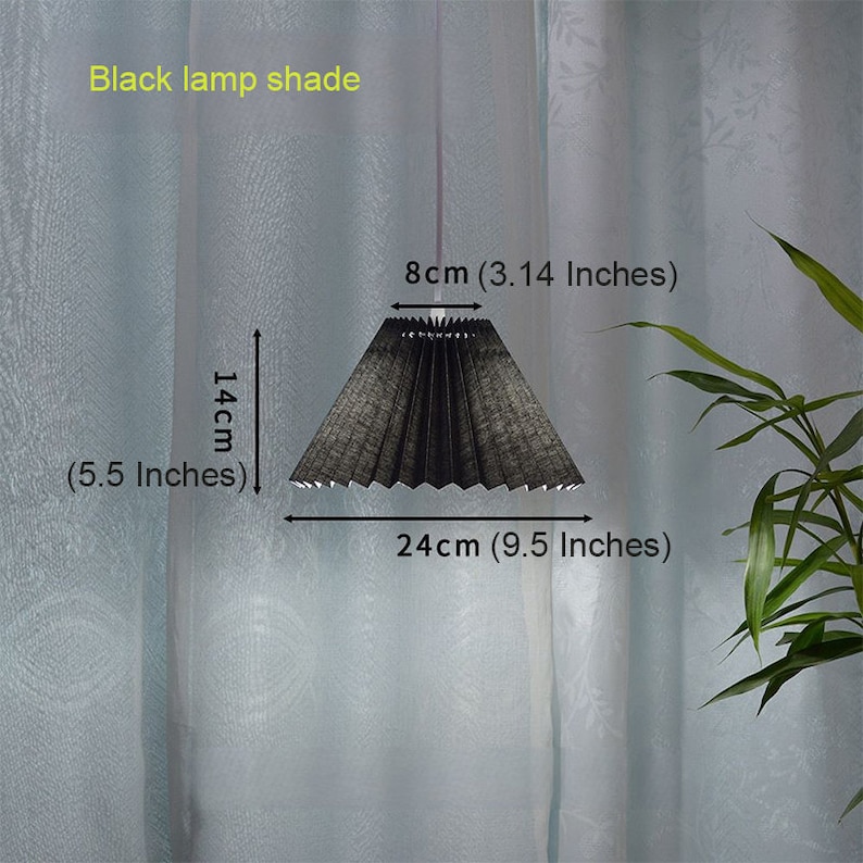 May include: Black lamp shade with a pleated design. The shade measures 9.5 inches in diameter and 5.5 inches in height.
