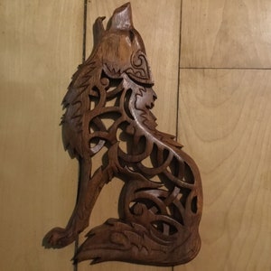Celtic howling wolf wood carving