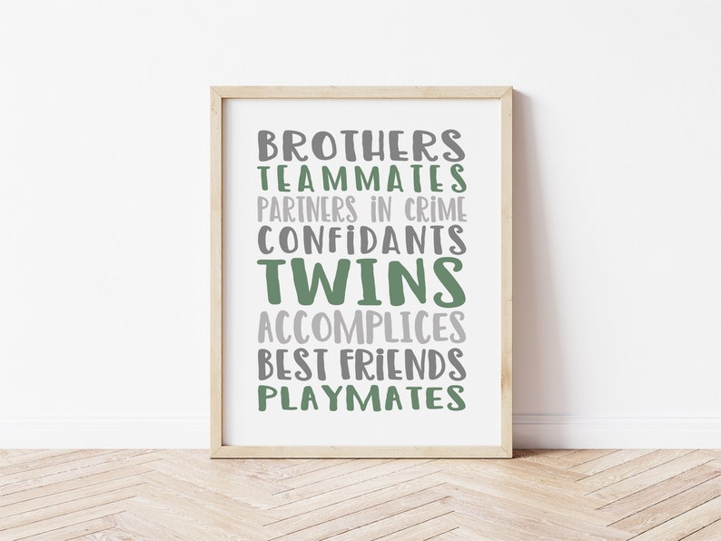 May include: A framed print with the words "Brothers, Teammates, Partners in Crime, Confidants, Twins, Accomplices, Best Friends, Playmates" in green and gray text.