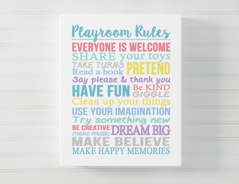 May include: Playroom Rules poster with colourful text on a white background. The text includes: Everyone is welcome, Share your toys, Take turns, Pretend, Read a book, Say please & thank you, Have fun, Be kind, Giggle, Clean up your things, Use your imagination, Try something new, Be creative, Dream big, Make music, Make believe, Make happy memories.