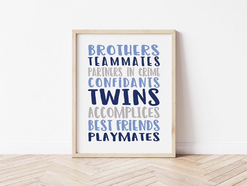 May include: A framed print with the words "Brothers, Teammates, Partners in Crime, Confidants, Twins, Accomplices, Best Friends, Playmates" in blue and gray text.