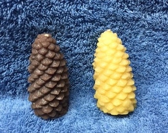 Small realistic pine cone candles