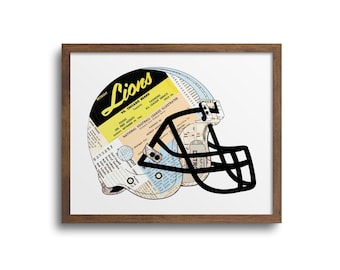 May include: A black and white illustration of a football helmet with a vintage newspaper clipping design. The helmet is made of blue and white paper and has a black face mask. The newspaper clipping features the text "Detroit Lions vs. Chicago Bears".