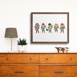 May include: A framed print of five cartoon characters, each with a different colored hat and a newspaper-like face. The characters are wearing different outfits and accessories, including a purse and glasses. The print is set against a white wall, above a wooden dresser.