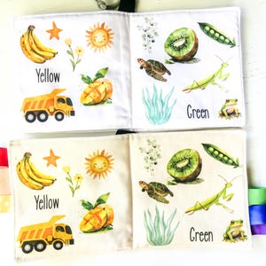 May include: A colorful fabric book for babies and toddlers with images of a yellow banana, a yellow sun, a yellow truck, a green kiwi, a green mantis, a green frog, and the words "Yellow" and "Green".