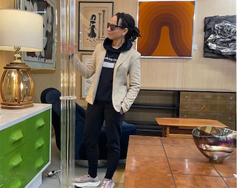 May include: A tall floor lamp featuring a cylindrical, fluted clear acrylic column supported by a polished brass base and topped with a circular brass plate. The lamp has a vertical brass rod running through the center of the transparent acrylic structure.
