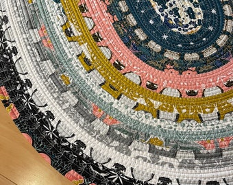 Jelly roll throw rug “ Coral Nebula” a blend of coral, teal, gray and mustard