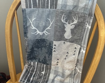 Gendered neutral baby blanket in shades of gray with a deer print