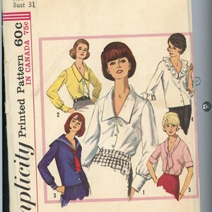 May include: Vintage Simplicity sewing pattern featuring five blouse designs. The pattern cover shows illustrations of the blouses in various colors, including white, yellow, pink, and navy. The pattern size is 10, with a bust measurement of 31 inches.