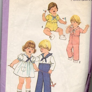 May include: Simplicity 8813 sewing pattern for toddler clothing. The pattern features illustrations of children in sailor-themed outfits, including a dress, romper, and sailor suit. The pattern is size 2.