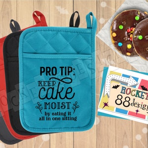 May include: Three oven mitts in black, red, and teal with a quilted design. The teal mitt has the text "PRO TIP: KEEP cake MOIST by eating it all in one sitting" printed on it.