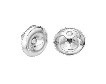 May include: A pair of silver earring backs. The backs are round and have a small hole in the center. They are designed to be used with post earrings.