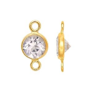 May include: Gold-tone connector with a clear round crystal in the centre. The connector has two loops on either side.