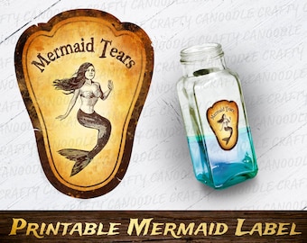 May include: Printable label for a bottle of "Mermaid Tears" with a vintage illustration of a mermaid with long flowing hair and a tail. The label is on a brown background with a distressed look.