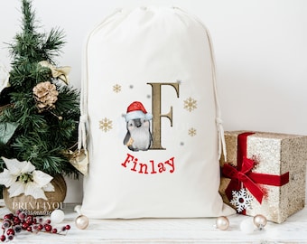 Personalised Santa Sack, Babies First Christmas, Xmas Toy Sack, Gift from Santa - Penguin Alphabet with a Father Christmas Hat
