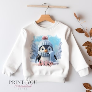 Personalised Christmas Jumper For Children.  White Cotton Sweatshirt - Cute Winter Penguin Graphics