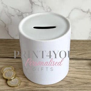 a white trash can sitting on top of a wooden table