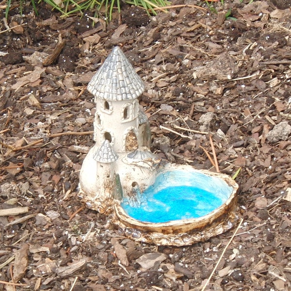 small ceramic bird bath with lantern tower